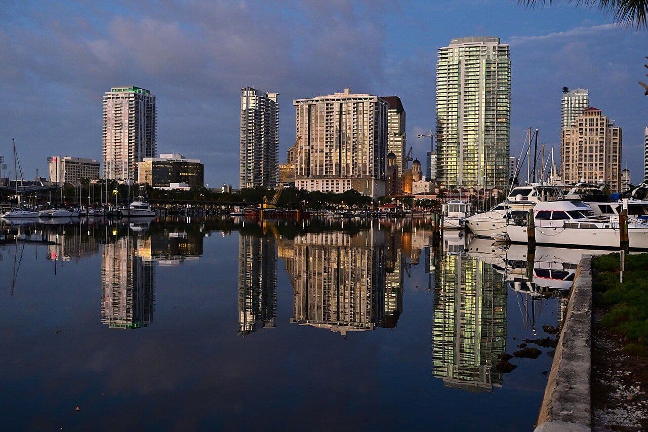 St. Petersburg high-rises reflected in still marina water just before sunrise