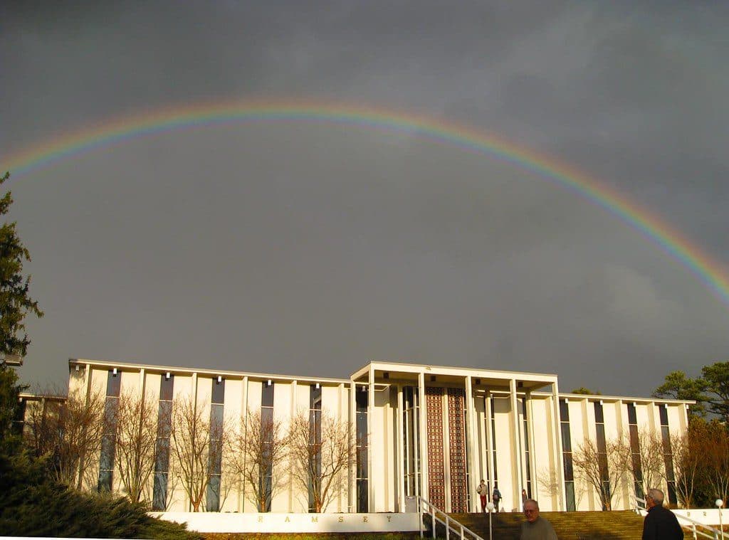 Ramsey Library at UNC Asheville under a rainbow and dark clouds